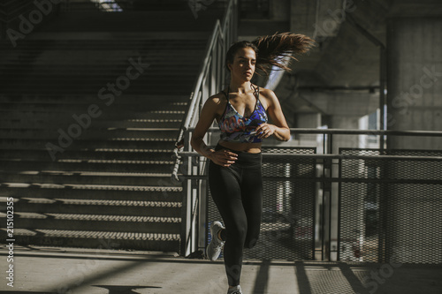 Young woman running in the urban environment