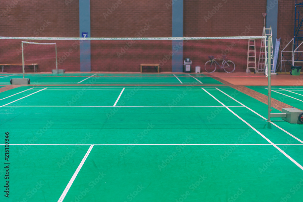 line on green badminton court