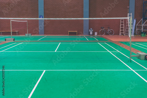 line on green badminton court