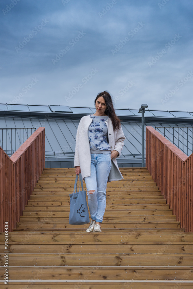 Woman on a wooden staircase Woman on a wooden staircase