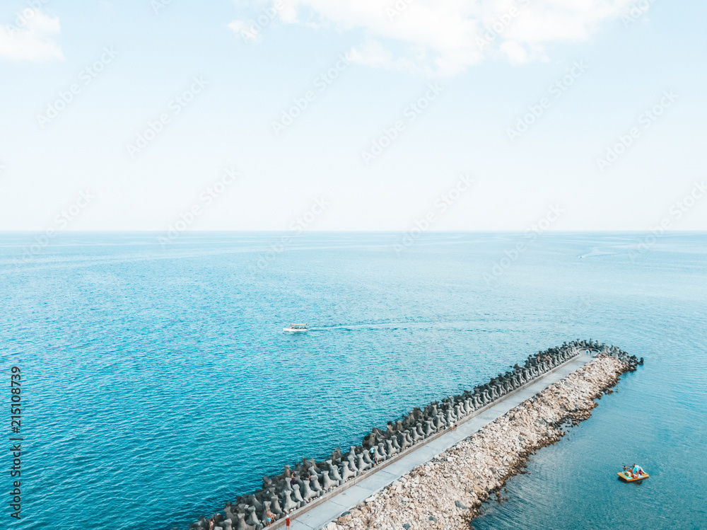 Aerial Drone View Of Concrete Pier On Turquoise Water At The Black Sea Aerial Drone View Of Concrete Pier On Turquoise Water At The Black Sea