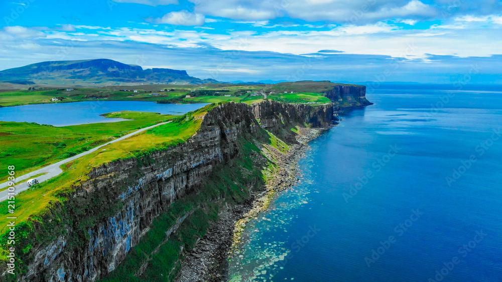 Aerial view over the green coastline and cliffs on the Isle of Skye in Scotland Aerial view over the green coastline and cliffs on the Isle of Skye in Scotland