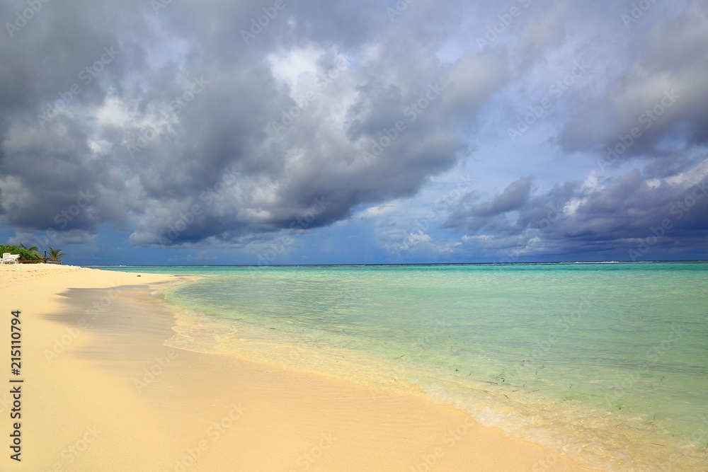 Gorgeous view of white sand beach line , Maldives, Indian Ocean. Transparent turquoise water on skyline background. Amazing nature background. Gorgeous view of white sand beach line , Maldives, Indian Ocean. Transparent turquoise water on skyline background. Amazing nature background.
