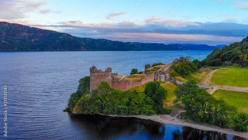 Urquhart Castle at famous Lake Loch Ness in the evening - aerial view