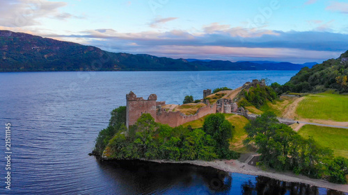 Urquhart Castle at famous Lake Loch Ness in the evening - aerial view
