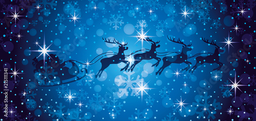 Santa Claus and reindeers in the Christmas night sky.