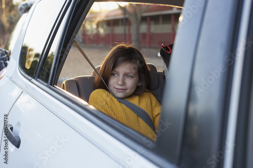 A girl arrives at school through the car loop photo