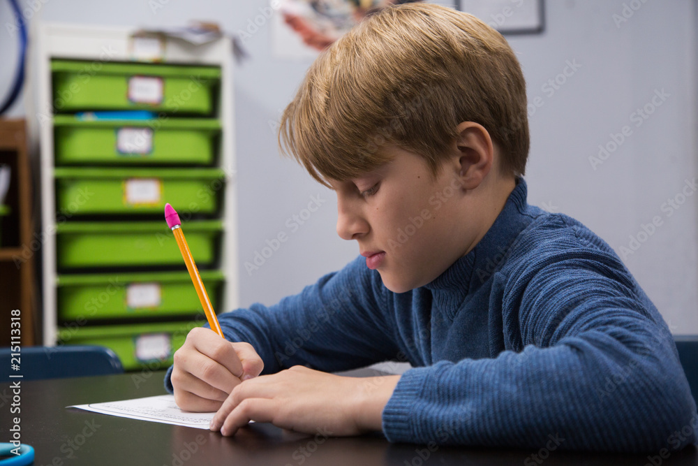 Boy in a classroom at school Boy in a classroom at school