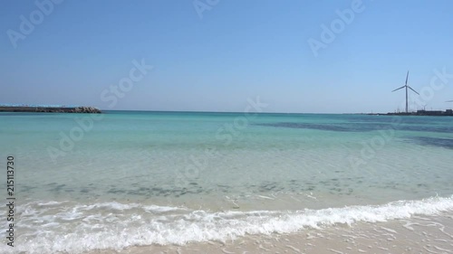 panorama over jeju beach in southkorea and windpower in the far away photo