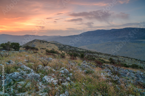 Mountain view at sunset somewhere in Croatia,rocks and grass,long exposure © Andriy Stefanyshyn