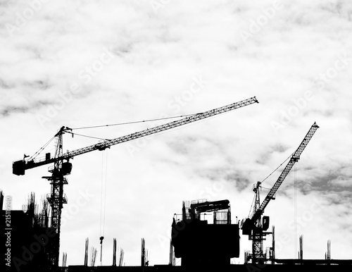 construction cranes on industrial construction site