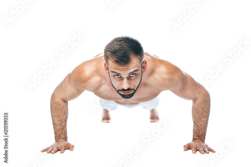 Push ups. bodybuilder posing. Beautiful sporty guy male power. Fitness muscled manin white lingerie. on isolated white background.