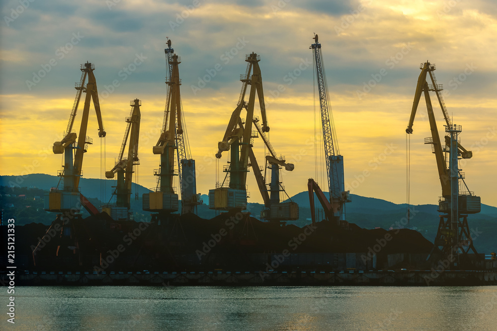 Loading cranes at the port at dawn
