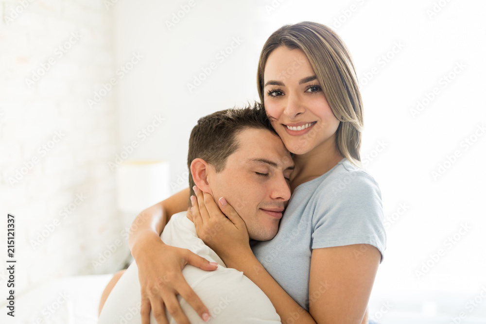 Female Embracing Man With Affection At Home Female Embracing Man With Affection At Home