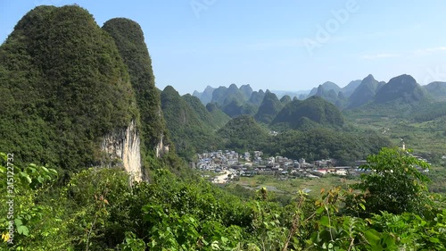 Scenic countryside with karst hills from the summit of Moon Hill of Yangshuo county. Guilin, Guangxi Zhuang, China  photo