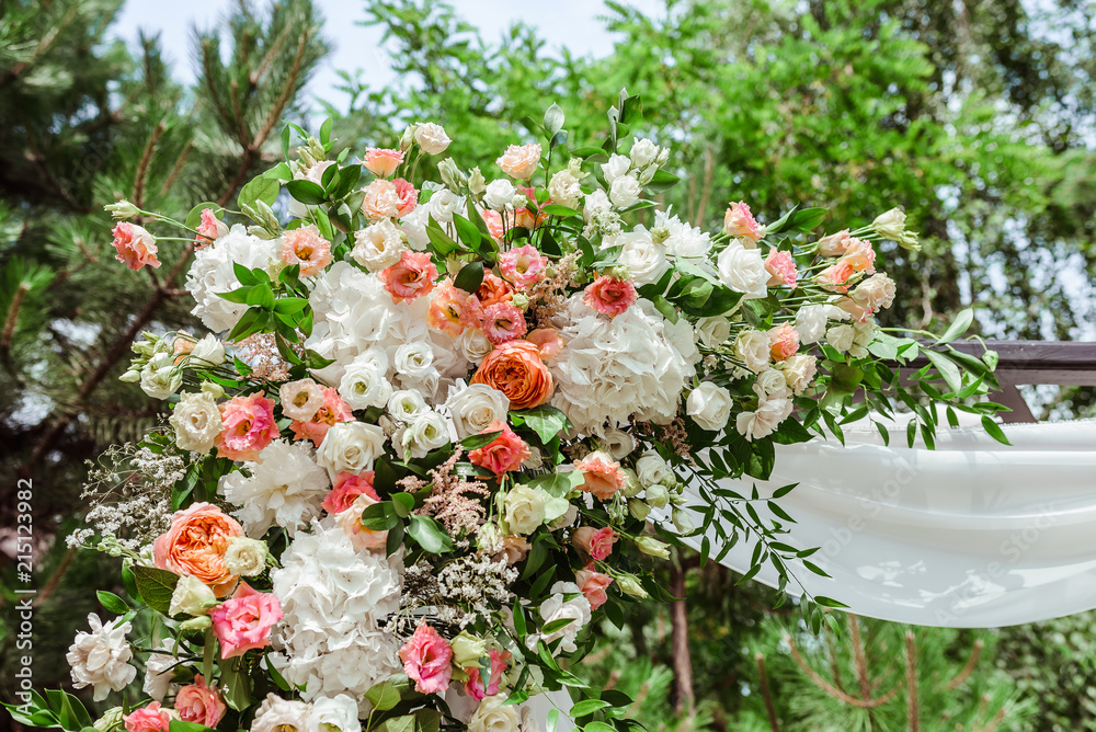 High vertical composition from flowers on a wedding arch