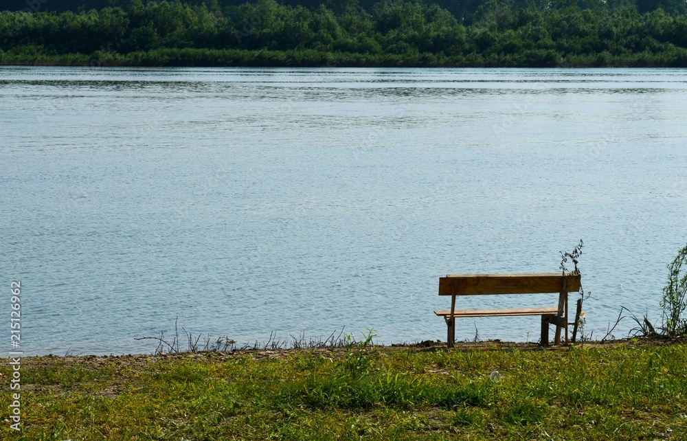 bench on the river bank