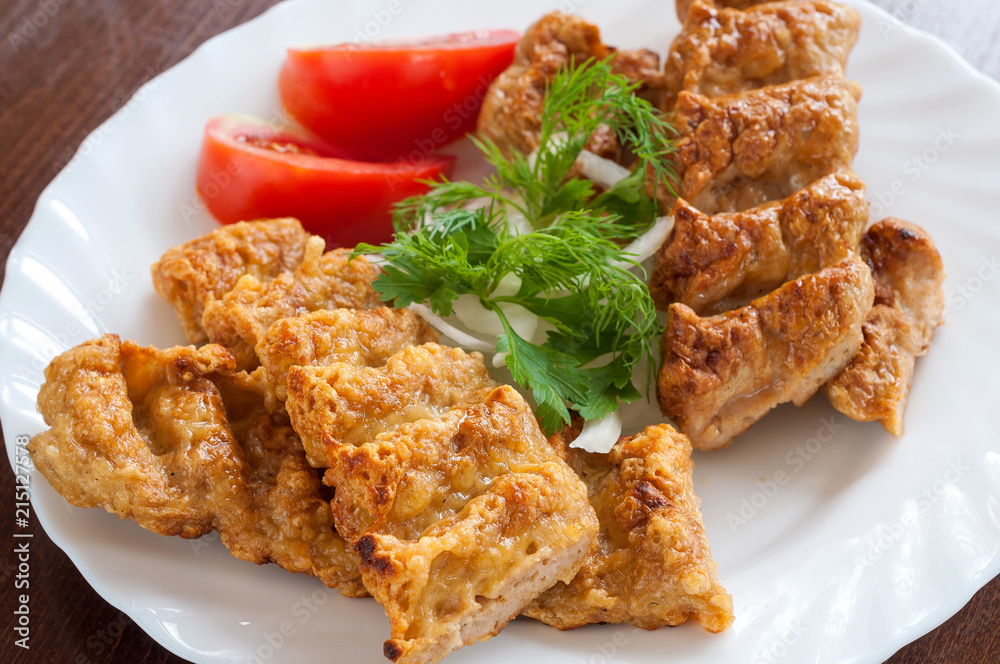 Grilled Lula kebab in a white dish Grilled Lula kebab in a white dish