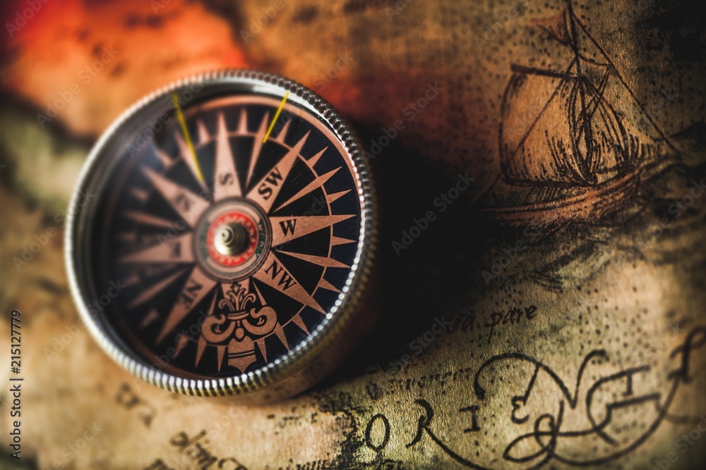 Closeup of an Old Compass on an Old Map