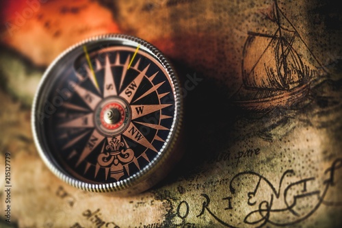 Fototapeta Closeup of an Old Compass on an Old Map