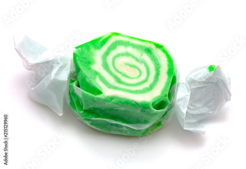 Single Piece of Green Salt Water Taffy on a White Background