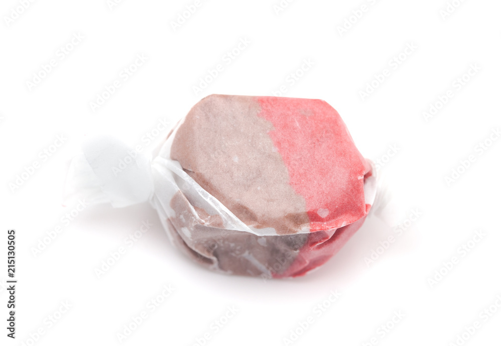 Single Piece of Brown and Red Salt Water Taffy on a White Background Single Piece of Brown and Red Salt Water Taffy on a White Background