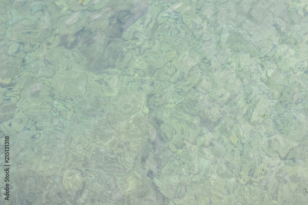 soft focus water surface background texture with small waves and empty space for copy or text
