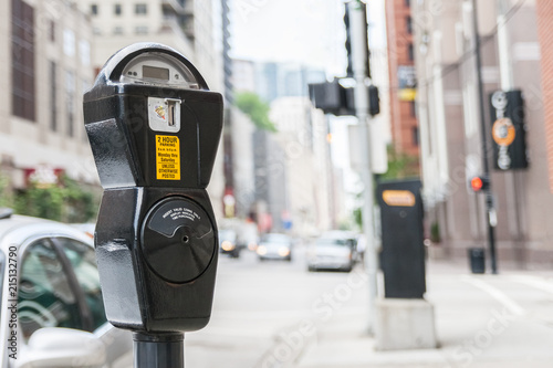 Close-up of a generic american parking meter in the streets of downtown chicago with large copy space, usa.