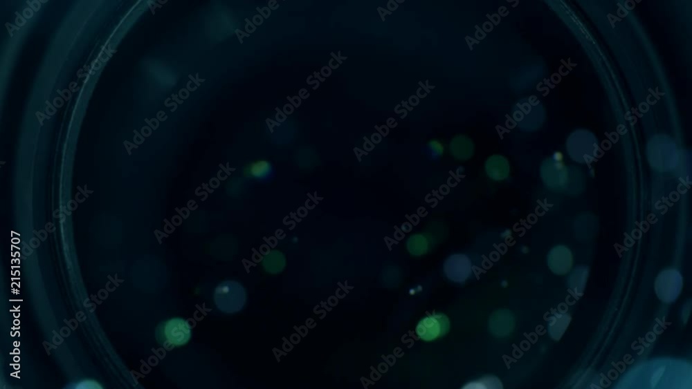 Video camera lens zooming in and out, close up