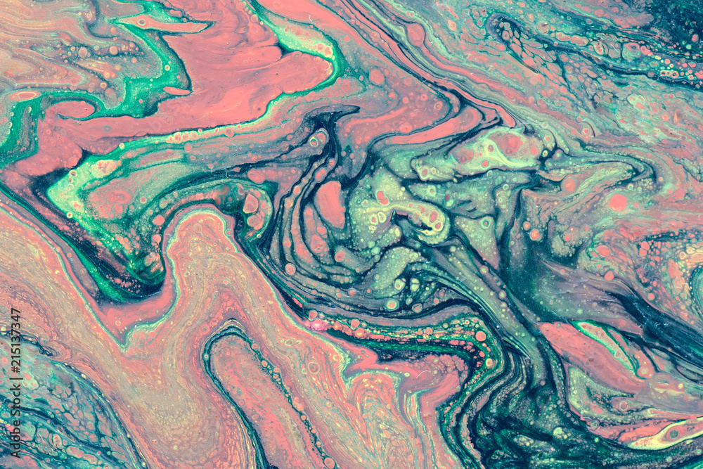 Сreative abstract marbling textured background. Mixing red, green and blue paints. Handmade surface. Liquid paint.