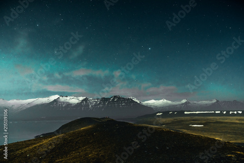 Northern lights on the Diamond beach in south east Iceland, Jokursarlon Vik ice rocks ocean photo