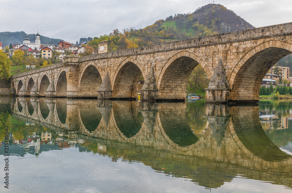 Fototapeta premium Visegrad, Bosnia & Herzegovina - the Mehmed Paša Sokolovic Bridge is one of the main landmarks in the country, and Visegrad one of the pearls of the Balkans
