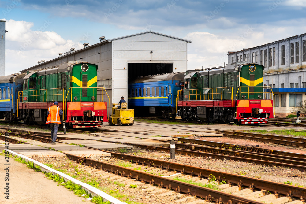 electric shunting train of green color during maneuvers at the railway station, shunting locomotive with electric transmission, Czechoslovak shunting locomotive