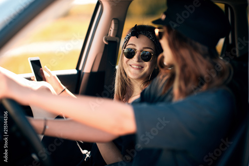 Two young women having fun on road trip