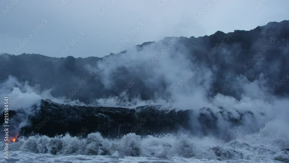 Molten Lava Streams from Hawaii's Kilauea Volcano Into the Ocean At Dawn Molten Lava Streams from Hawaii's Kilauea Volcano Into the Ocean At Dawn