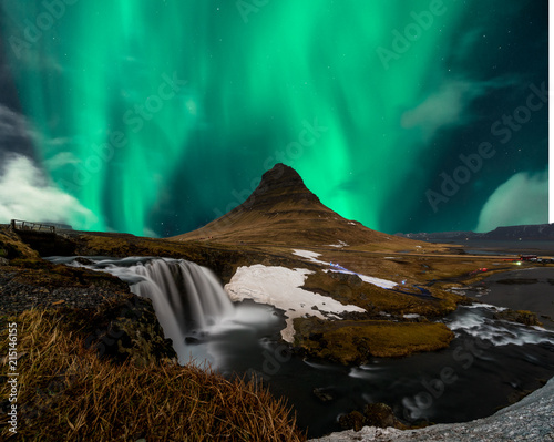 Northern lights aurora borealis appear over Mount Kirkjufell in Iceland. photo