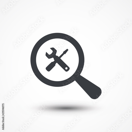 Magnifying glass with tools icon