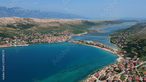 Wide angle footage of beautiful beach with the blue sea from the sky