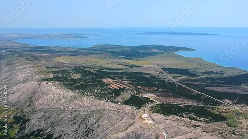Coastline with blue sea and winding mountain road