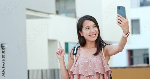 Woman taking selfie on cellphone in Shum Yip Upperhills of shenzhen photo