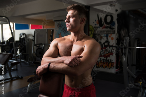 Attractive Young Man Resting In Gym Afther Exercise