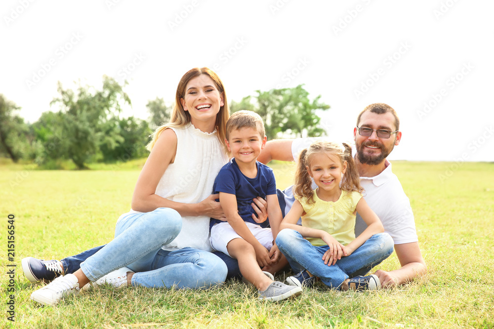 Happy family spending time together with their children outdoors