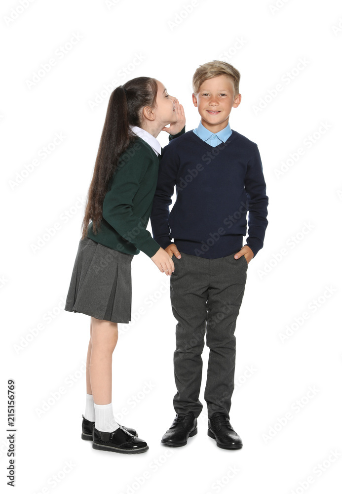 Little children in stylish school uniform on white background Little children in stylish school uniform on white background