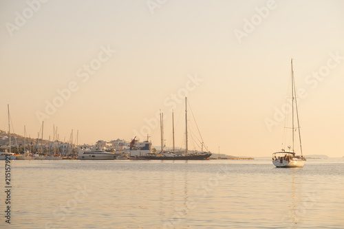 Yachts and boats in sunset near Parikia port, Paros island, Greece