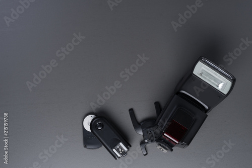 Professional photo camera flash light isolated on grey photo