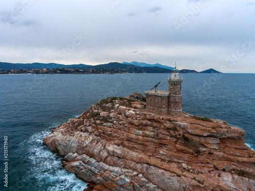 Fotografie Rocky island Scoglietto near the shores of the Italian island of Elba
