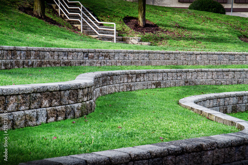 Rock work divides green grass