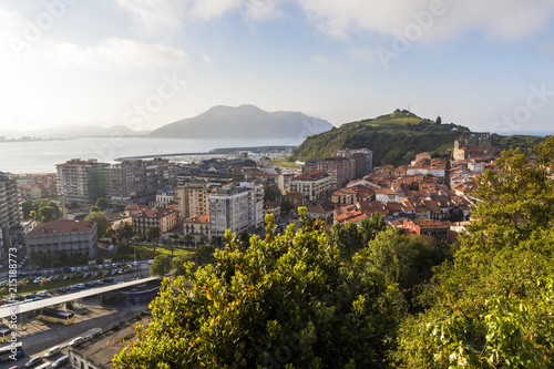 Laredo, Spain. Scenic seascape sunset view of the town of Laredo, with the harbor and La Atalaya, a volcanic cone