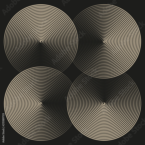 four graphic disks with rotating shadows in ivory on black