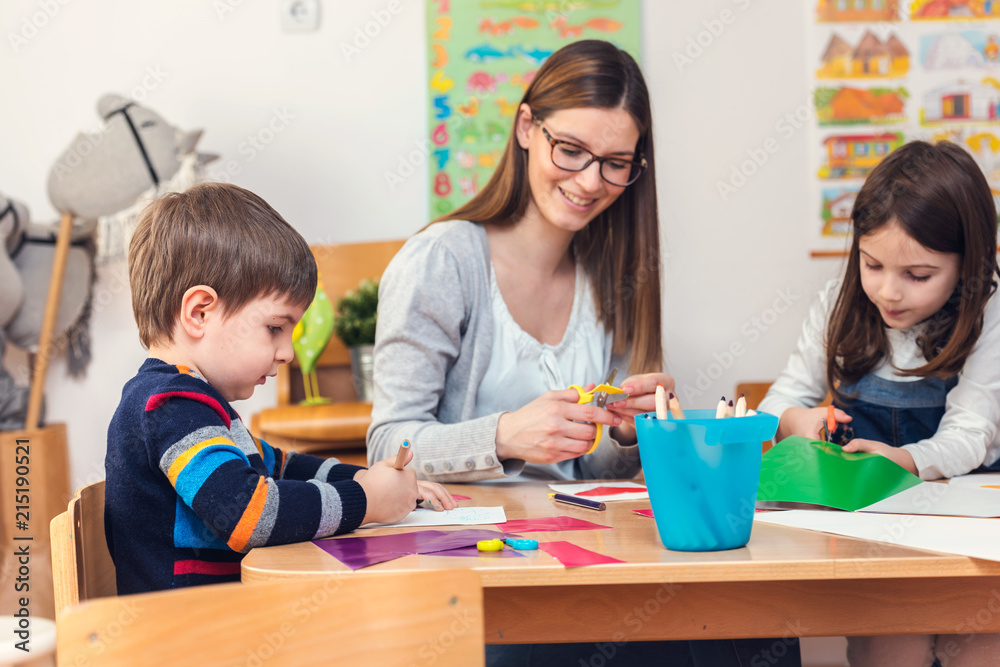 Preschool Teacher with Children at Kindergarten - Creative Art Class Preschool Teacher with Children at Kindergarten - Creative Art Class